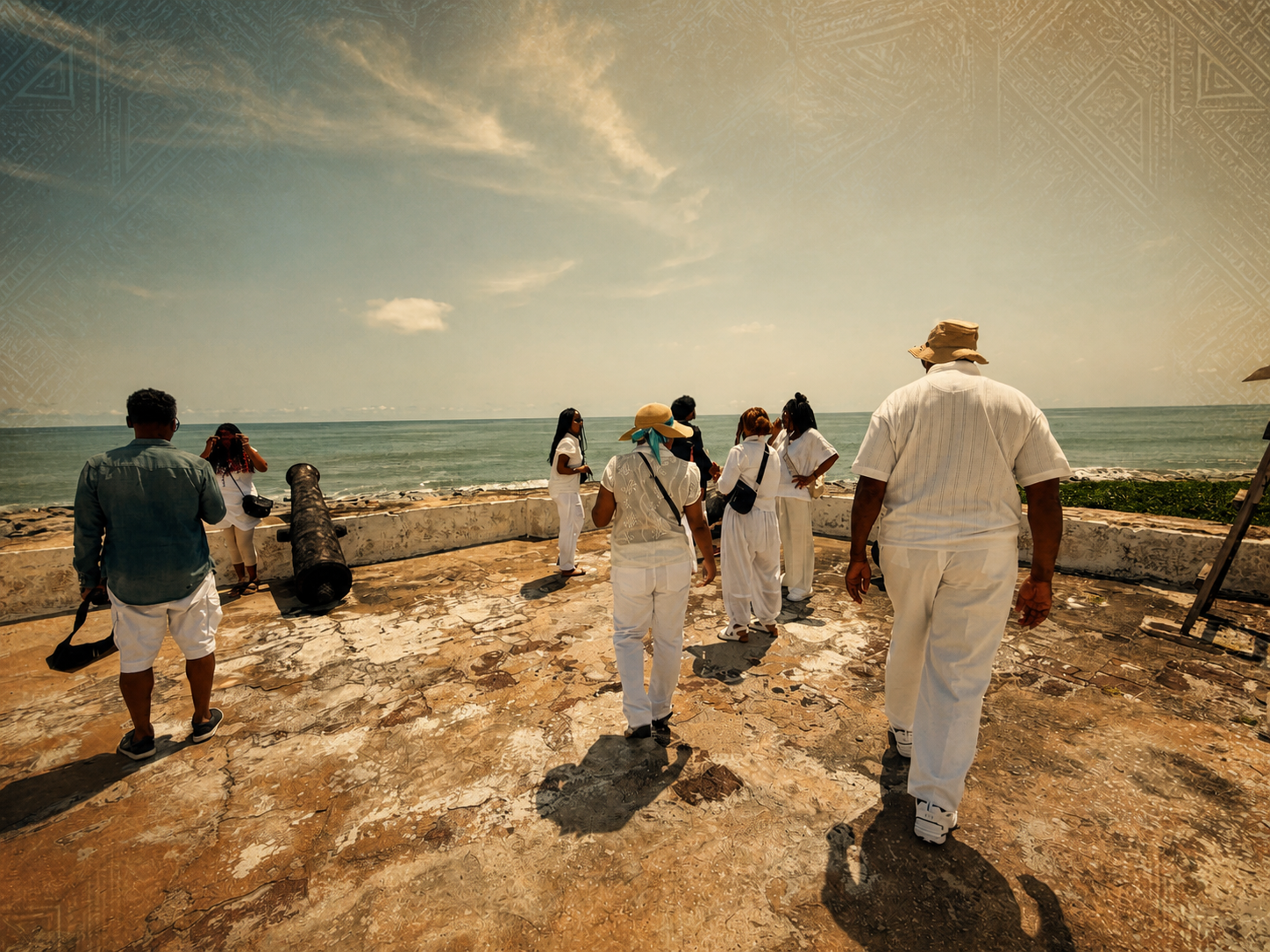 Travelers walking toward the Atlantic beside a historic coastal cannon on a previous Wadisons journey